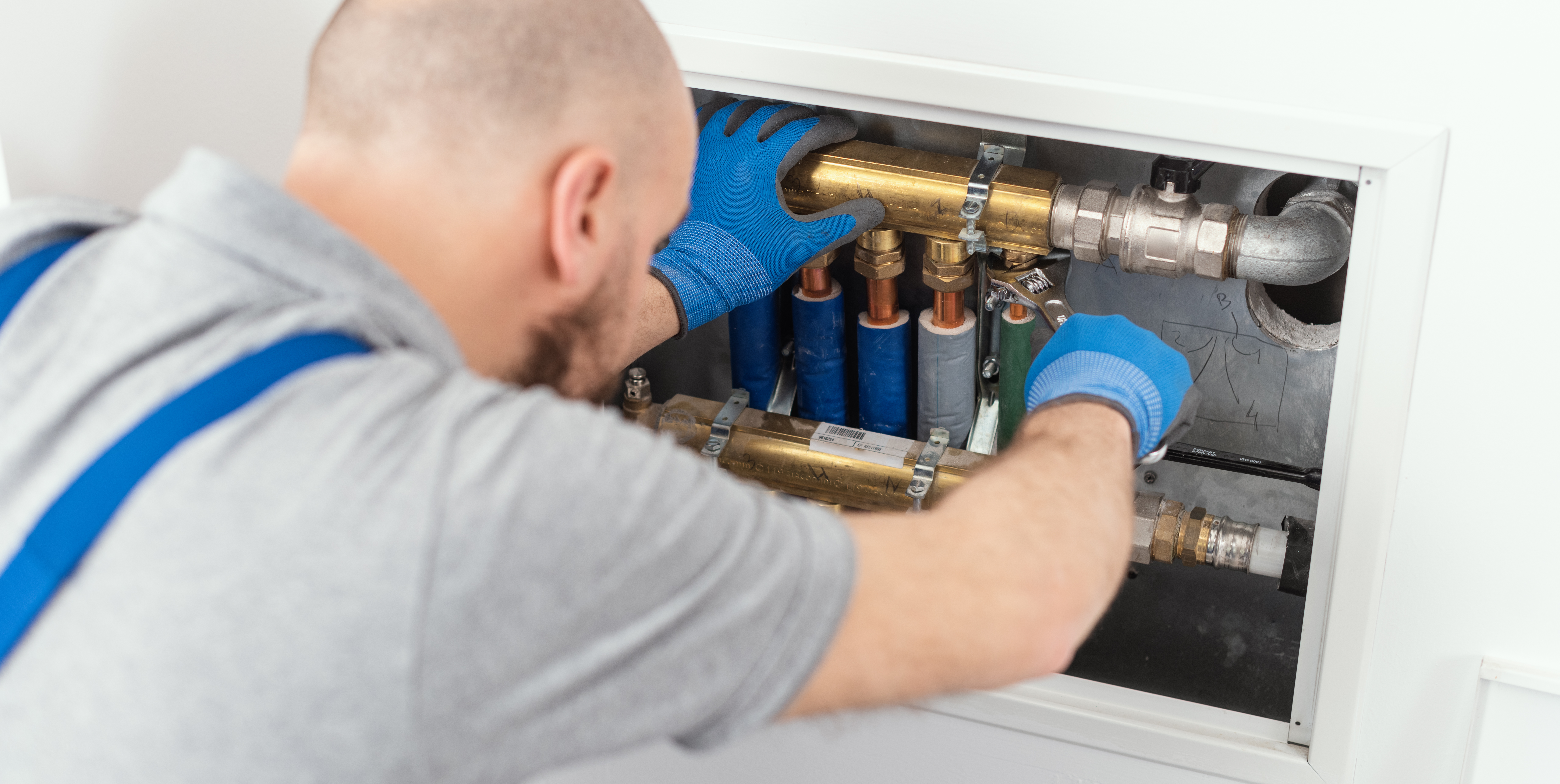 Professional plumber installing plumbing